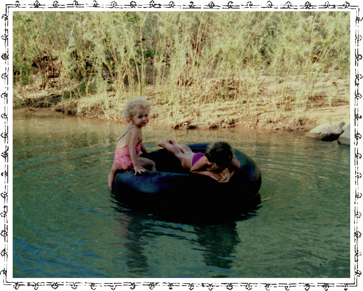 Kids in a floating tube in a river