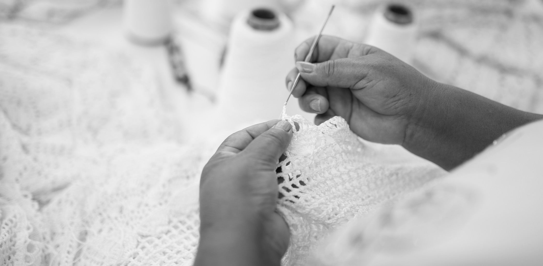 Close-up of hands knitting with a blurred background