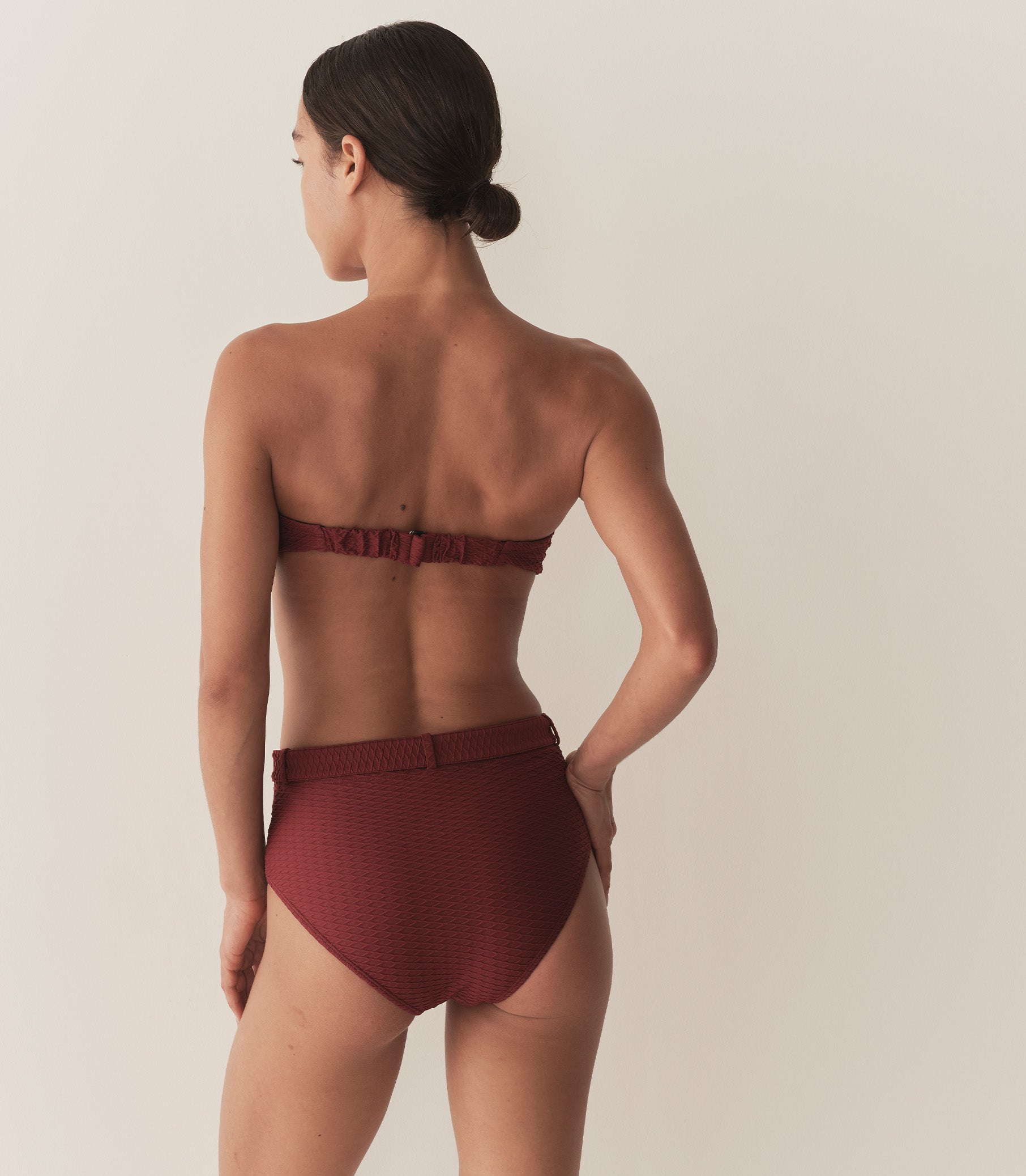 Zahara wears a deep burgundy matching bikini set. 9
